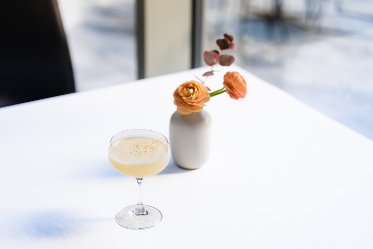 a glass of wine on a table